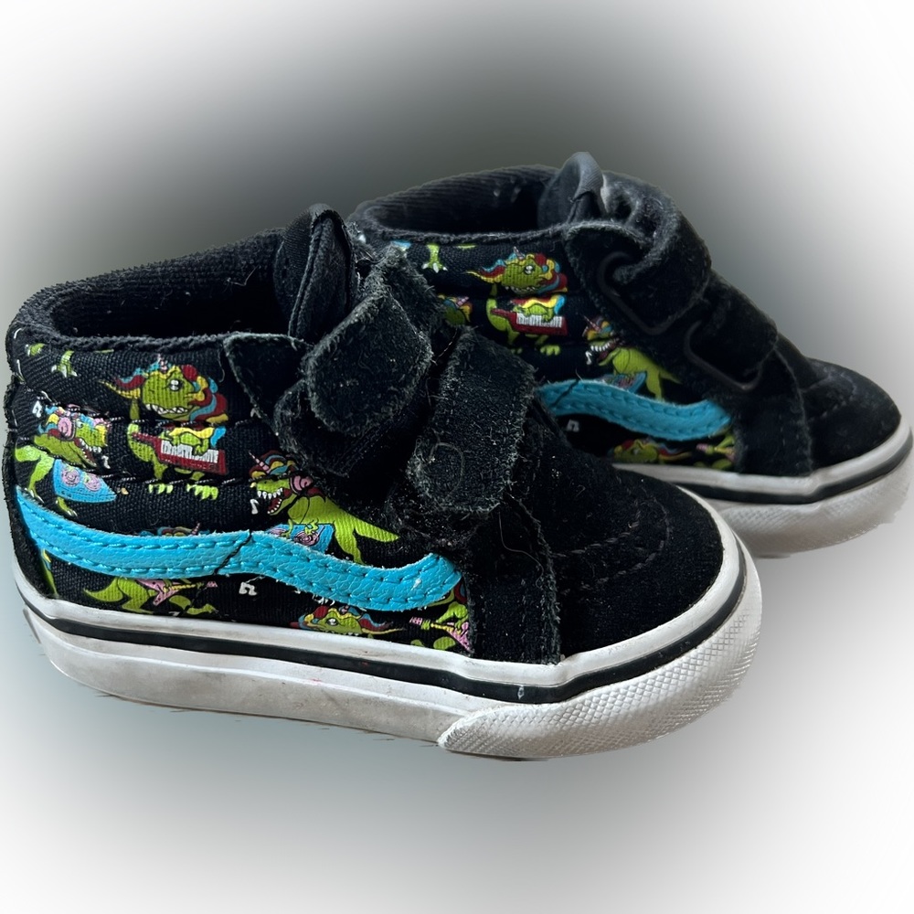 Black Vans midtop with dancing music dinosaurs